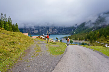 Hikers and trail to Oeschinen lake, a UNESCO site, Kandersteg Switzerland 