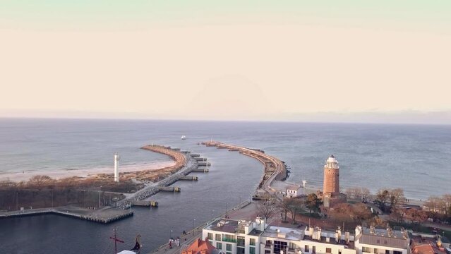Sunny Winter Arrival: Maritime Majesty in Kołobrzeg Harbor. Kolobrzeg, Poland. Aerial footage.
