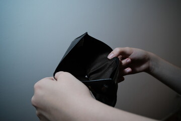 person holding an empty wallet