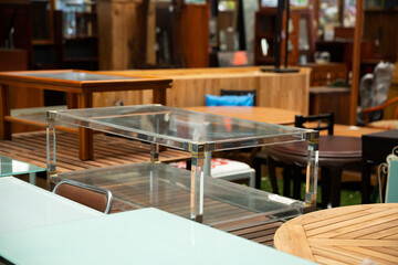 Interior of furniture shop with variety of comfortable and stylish tables for sale ..