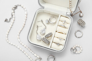 Organizer with stylish jewelry on white background