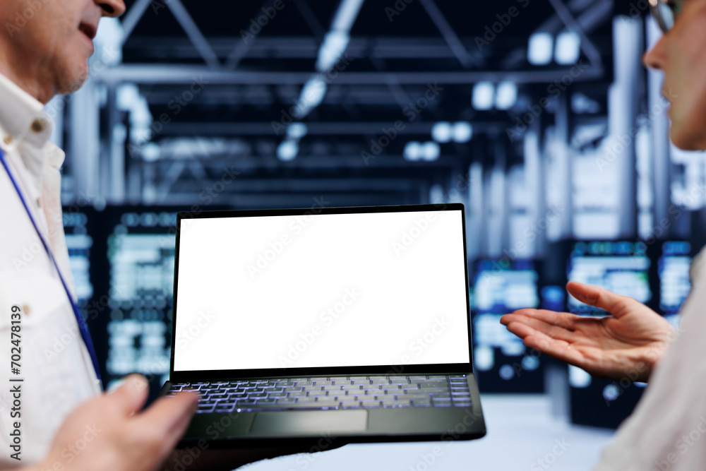Poster close up shot of mock up laptop used by meticulous employee in cloud computing business server room 