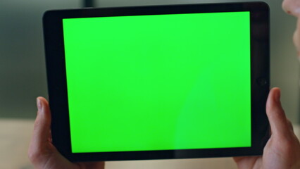 User holding chromakey computer indoors closeup. Woman talking device video call