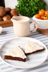 Plate of tasty sandwiches with cream cheese on table