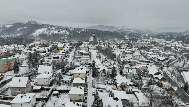 Limanowa, Poland - snowy winter over Polish town, snow storm at european city suburb residential district, snowfall and snowstorm at europe