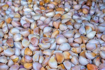 Many Garlic Cloves up for sale in Thailand market place.