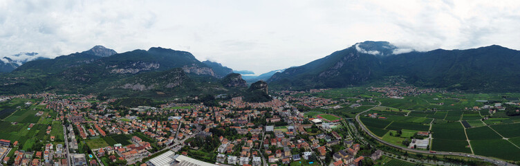 Fototapeta na wymiar Aerial view of Arco village and his Arco castle on high rock view, Sarca Valley, Trentino Alto Adige region of Italy . Arco, Trento, Italy