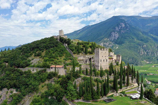 Aerial view of Arco castle (Castello di Arco) on high rock view, Sarca Valley, Trentino Alto Adige region of Italy. Arco, Trento, Italy