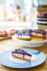 Cheesecake with winter berry forest fruits, serving slices
