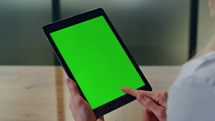 Manager finger touching greenscreen tablet at office. Woman using chromakey tab