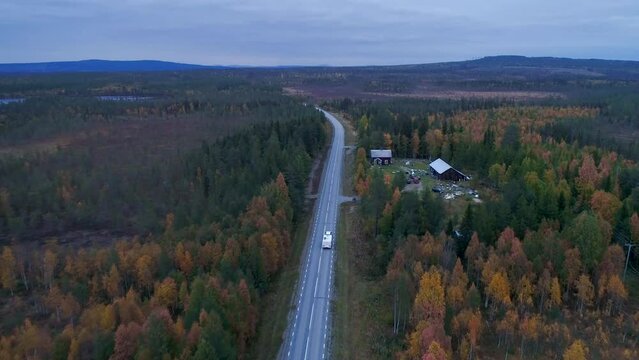 Caravan Camping driving on E45 Higway Road through the wilderness of middle Sweden near the town Lomsele