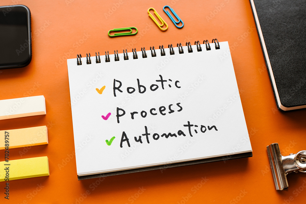 Poster there is notebook with the word robotic process automation. it is as an eye-catching image.