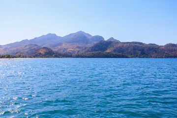 View of mountain landscapes from the sea. Background with selective focus and copy space