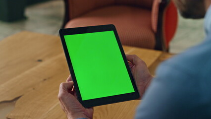 Greenscreen pad manager hands holding office close up. Man reading mockup screen