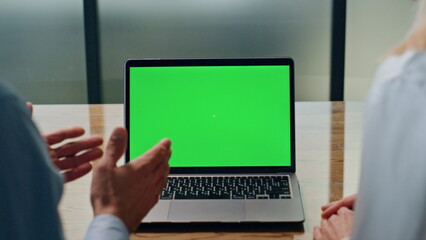 Businessman gesturing hands at greenscreen laptop call. Colleagues videocalling