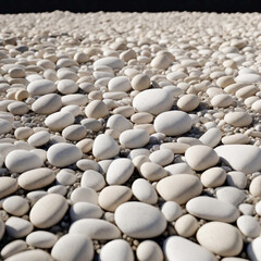 Clean white pebbles texture. There are small stones on the ground. Top view of natural colored gravel on summer beach