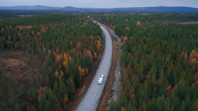 Caravan Camping driving on E45 Higway Road through the wilderness of middle Sweden near the town Lomsele