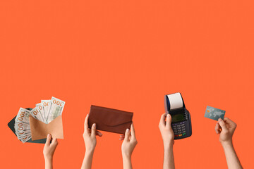 Female hands with wallet, payment terminal, credit card and money on orange background