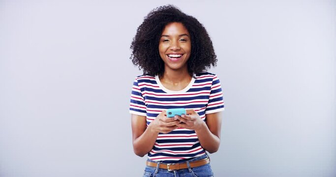 Black woman, typing on smartphone and funny in studio isolated on white background mockup space. Portrait, phone and laughing person scroll on mobile app, meme and comedy on internet or social media