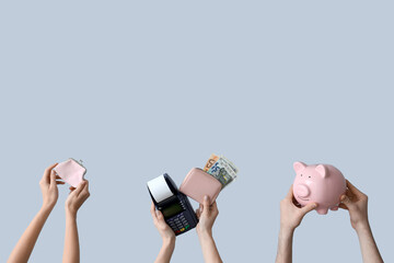 Female hands with wallets, piggy bank, payment terminal and money on grey background