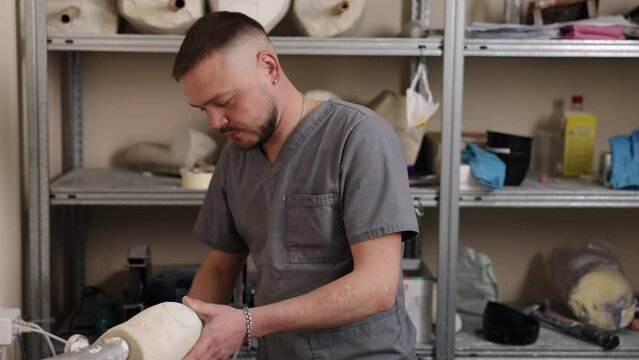 Mold design, Prosthesis leg, Efficiency improvement. Through removal of nonessential components, man expertly creating hip disarticulation prosthesis mold.