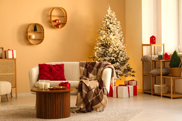 Stylish interior of modern living room with Christmas tree and gifts