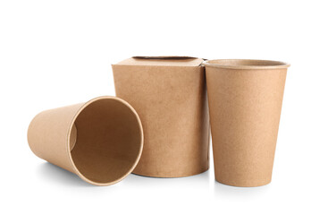 Takeaway paper cups and box on white background