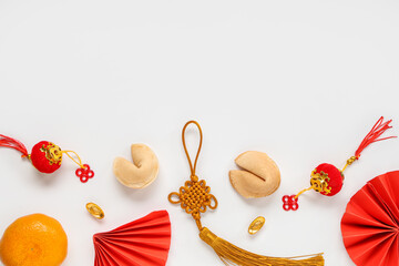 Fortune cookies with mandarin and Chinese symbols on white background. New Year celebration