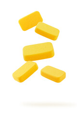 Falling yellow sponge isolated on white