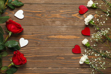 Gypsophila, carnations, roses and hearts on wooden background