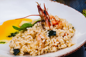 Risotto with seafood on white plate.