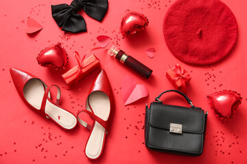 Composition with stylish female shoes, accessories and decor for Valentine's Day celebration on red background