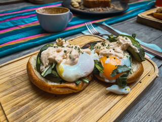 Eggs Benedict, delicious and nutritious breakfast, boiled eggs on box bread, accompanied by...