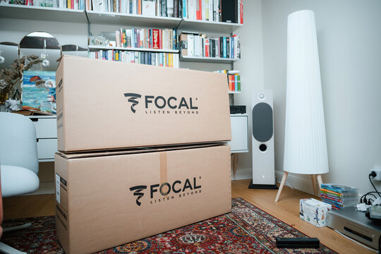 Paris, France - Nov 15, 2023: Unboxed Focal Chora speakers, made in France, installed in a living room with a vitose shelf cabinet, radiating luxury and warmth