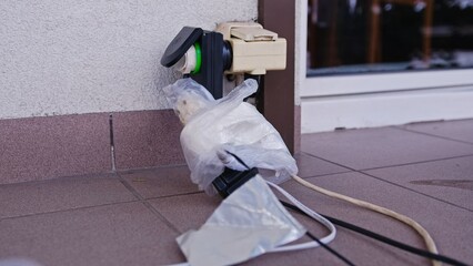 Electric Outlet Plug Extender with Multiple Power Cords Connected and Wrapped in Plastic Bags for...
