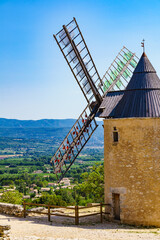 Wind mill in Saint-Saturnin-les-Apt village in France - obrazy, fototapety, plakaty