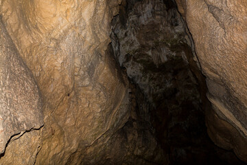 Speleology. The Bacho Kiro cave, Dryanovo, Bulgaria. Stalactite, and stalagmite speleothem formations.