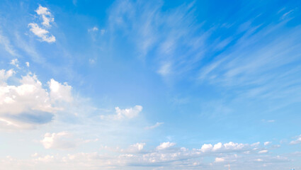 Blue sky with some clouds. View over the clouds light background.  - obrazy, fototapety, plakaty