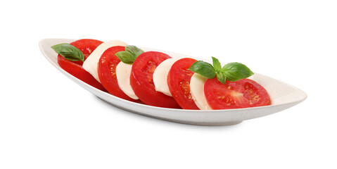 Plate of delicious Caprese salad with tomatoes, mozzarella and basil isolated on white