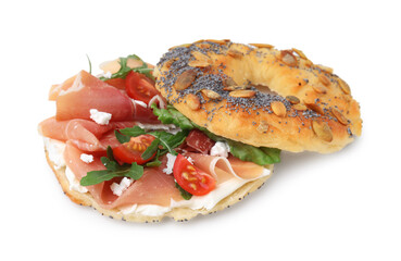 Tasty bagel with cured ham, arugula, cream cheese and tomatoes isolated on white