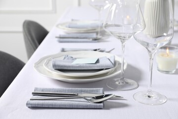 Beautiful table setting with fabric napkins indoors, selective focus