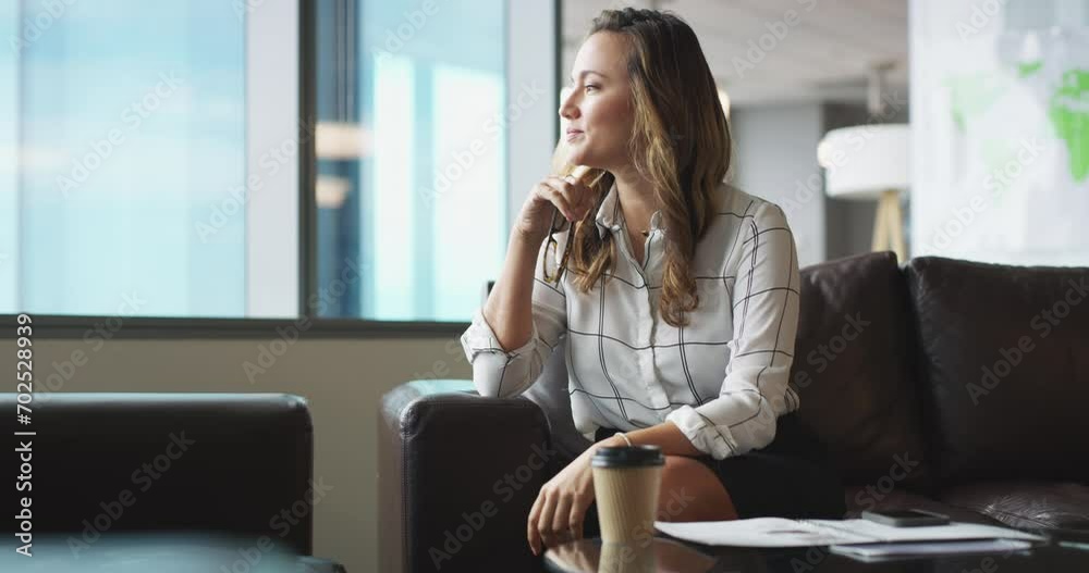 Wall mural Business woman, thinking and relax on sofa in modern office lounge for vision, ideas and brainstorming for solution. Lawyer, problem solving and process on couch for career development at law firm