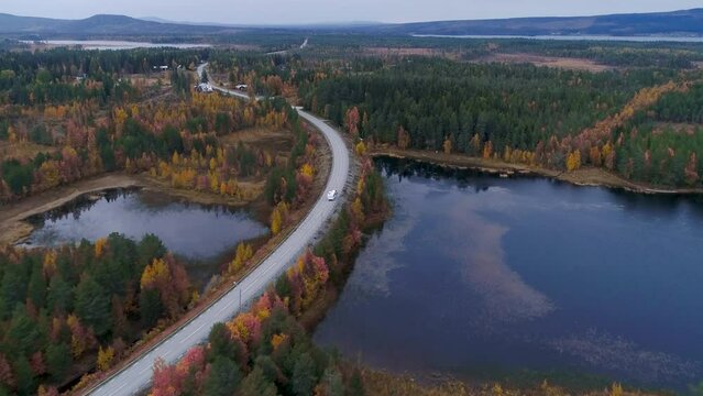 Caravan Camping driving on E45 Higway Road through the wilderness of middle Sweden near the town Lomsele
