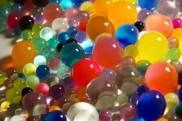 Abstract texture with multicolored transparent decorative gel balls. Hydrogel colorful round...