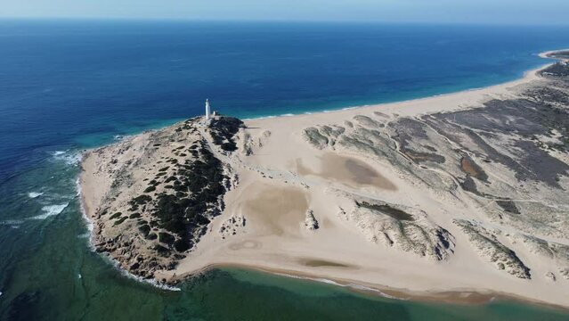 amazing aerial video of the lighthouse of canos de meca, atlantic ocean
