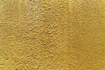 Crépi jaune doré sur mur