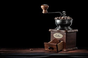 Classic Vintage Coffee Mill Standing On Wooden Board Isolated Black.
