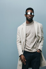 Fototapeta premium Cheerful african man wearing glasses jean jacket having white snow smile pointing fingers aside at copy space for your text advertisement, advertise teeth whitening or eyewear store good offer concept