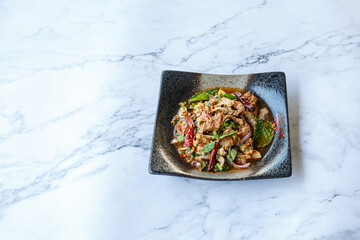 Spicy Thai grilled pork salad called 