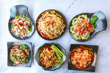 Traditional northeastern Thailand floods, Many variety various Isaan foods on a table.